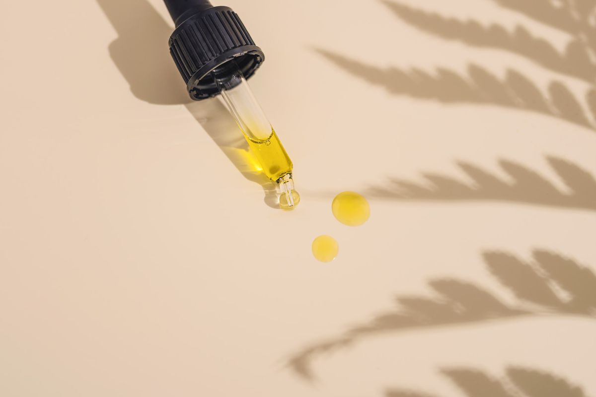 CBD oil dripping onto a surface